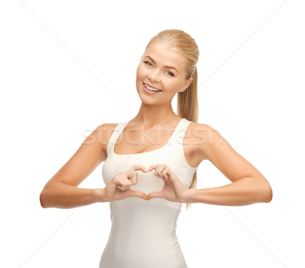 woman showing heart shape gesture Stock photo © dolgachov