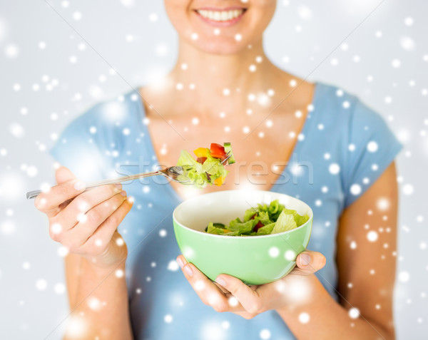 Stock photo: woman eating salad with vegetables