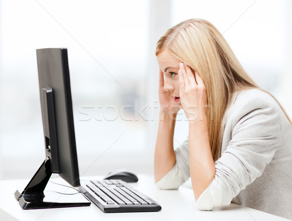 stressed woman with computer Stock photo © dolgachov