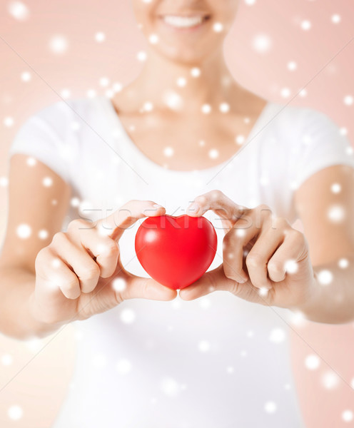 Donna mani cuore salute amore carità Foto d'archivio © dolgachov