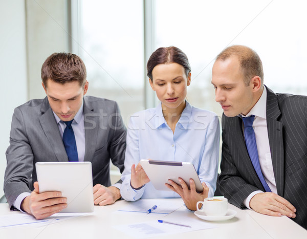 business team with tablet pc having discussion Stock photo © dolgachov