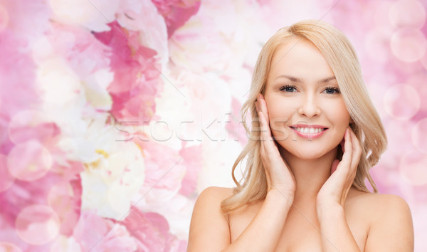 Stock photo: woman touching her face skin