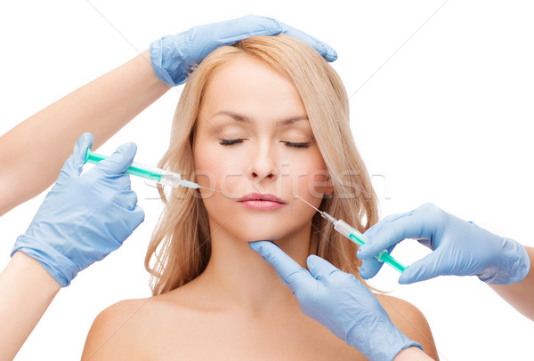 Vrouw gezicht handen schoonheid cosmetische chirurgie vrouw Stockfoto © dolgachov