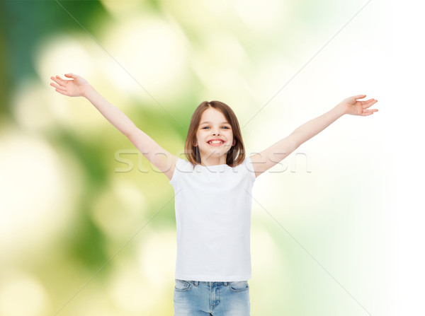 Sorridere bambina bianco tshirt pubblicità infanzia Foto d'archivio © dolgachov