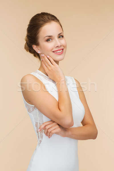 улыбающаяся женщина белое платье кольцо с бриллиантом празднования свадьба счастье Сток-фото © dolgachov