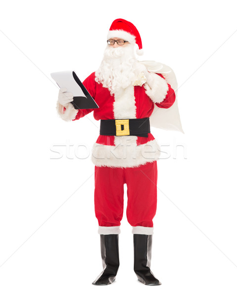 Adam kostüm noel baba notepad çanta Noel Stok fotoğraf © dolgachov