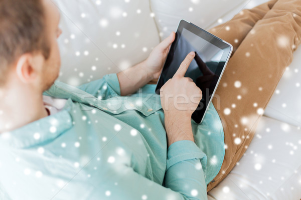 close up of man with tablet pc computer at home Stock photo © dolgachov