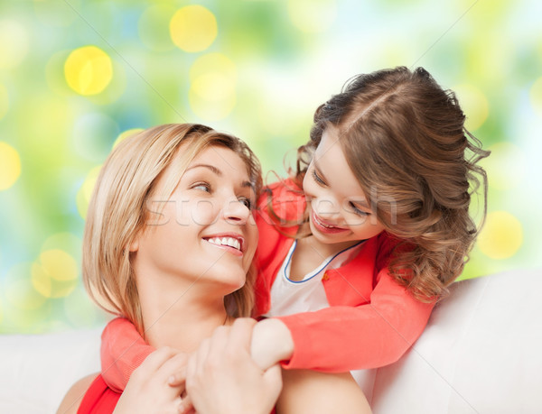 happy mother with daughter hugging and talking Stock photo © dolgachov