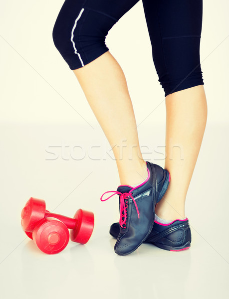 sporty woman legs with light red dumbbells Stock photo © dolgachov