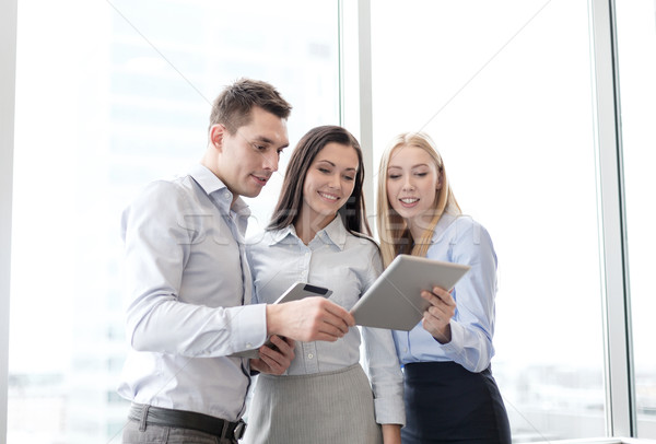 Stock photo: business team working with tablet pcs in office