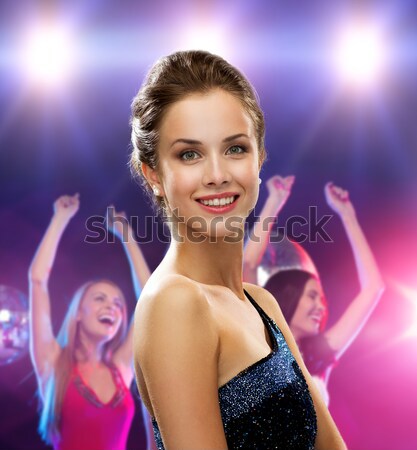 beautiful woman with champagne glass at nightclub Stock photo © dolgachov