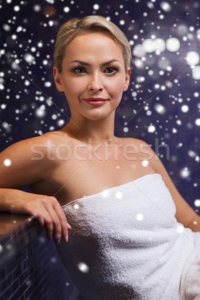 beautiful woman sitting in bath towel at sauna Stock photo © dolgachov