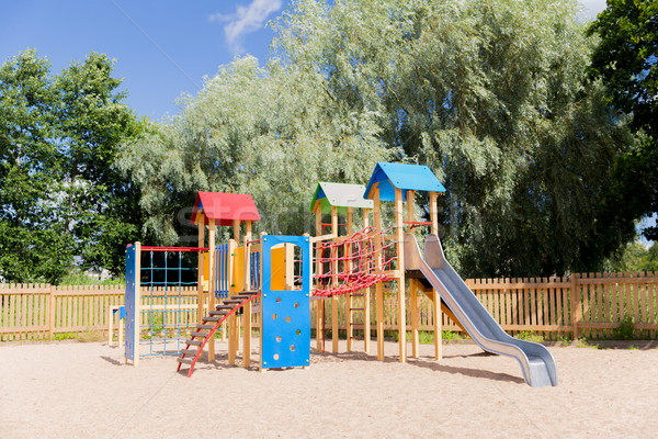 climbing frame with slide on playground at summer Stock photo © dolgachov