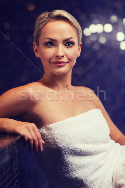 beautiful young woman sitting in bath towel Stock photo © dolgachov