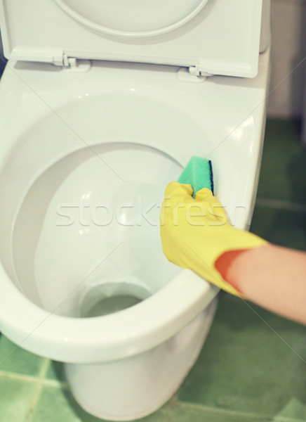 close up of hand with detergent cleaning toilet Stock photo © dolgachov