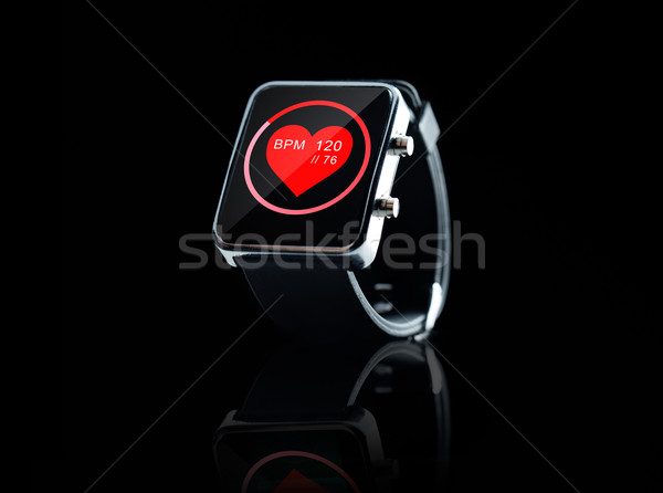 close up of black smart watch with heart beat icon Stock photo © dolgachov