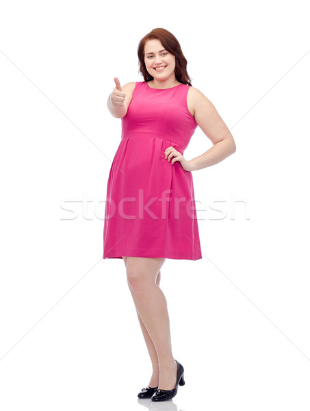 happy young plus size woman showing thumbs up Stock photo © dolgachov