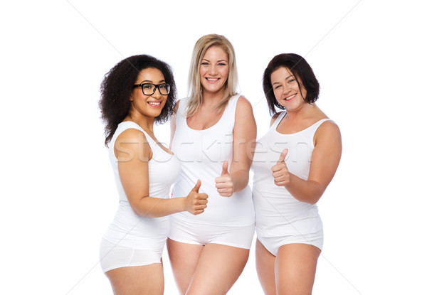 group of happy plus size women showing thumbs up Stock photo © dolgachov