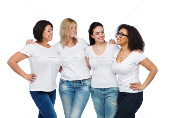 group of happy different women in white t-shirts Stock photo © dolgachov