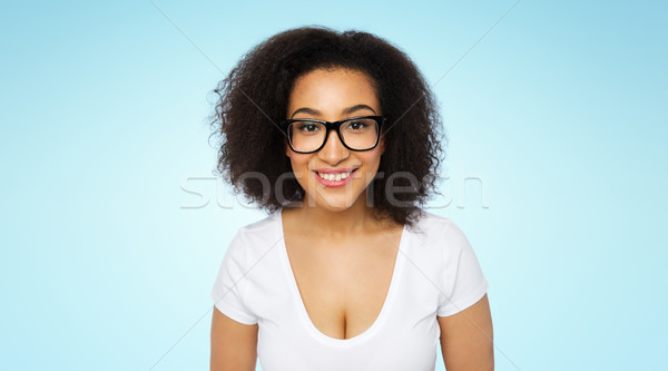 happy african woman or student girl in eyeglasses Stock photo © dolgachov
