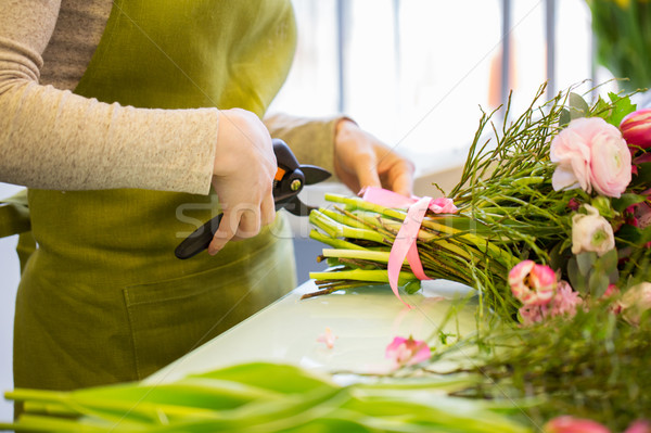 close up of florist woman with flowers and pruner Stock photo © dolgachov