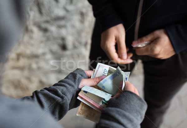 Stock photo: close up of addict buying dose from drug dealer