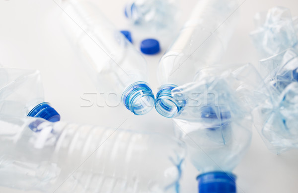 close up of empty used plastic bottles on table Stock photo © dolgachov