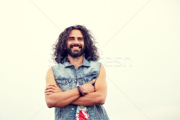 smiling young hippie man in demin vest Stock photo © dolgachov