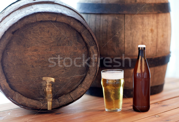 close up of old beer barrel, glass and bottle Stock photo © dolgachov