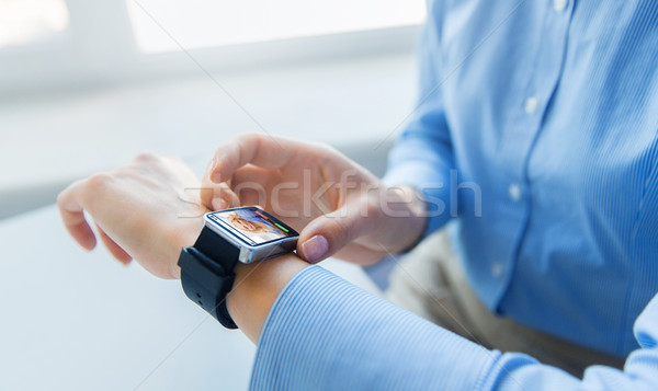 close up of hands with incoming call on smartwatch Stock photo © dolgachov