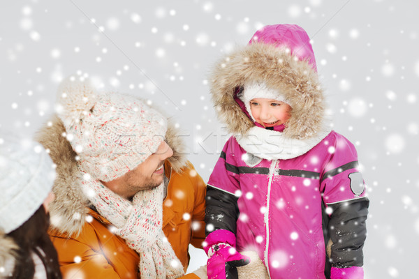 happy family with child in winter clothes outdoors Stock photo © dolgachov