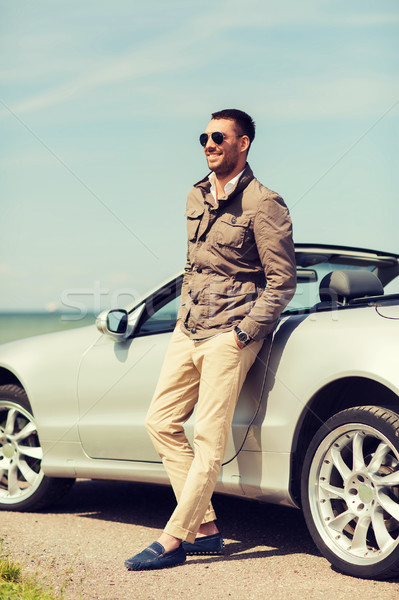 happy man near cabriolet car outdoors Stock photo © dolgachov