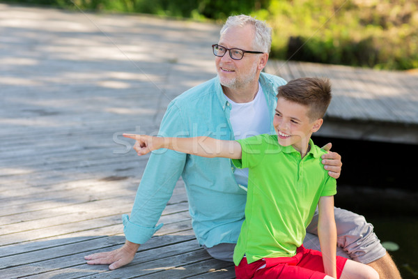 Grand-père petit-fils séance rivière famille génération [[stock_photo]] © dolgachov