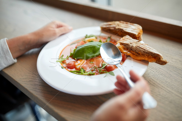 woman eating gazpacho soup at restaurant Stock photo © dolgachov