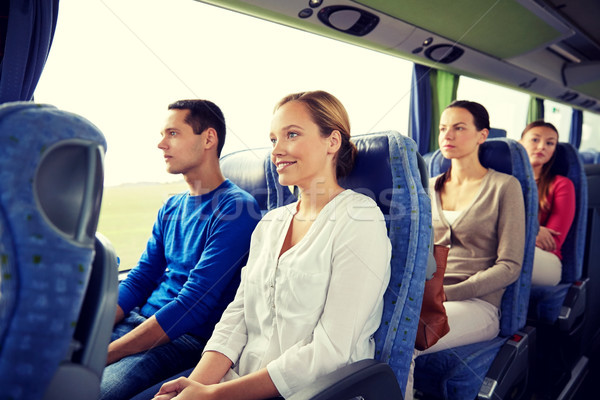 group of happy passengers in travel bus Stock photo © dolgachov