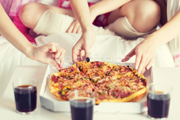 friends or teen girls eating pizza at home Stock photo © dolgachov