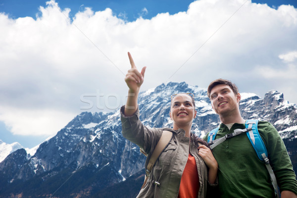 Stock photo: happy couple with backpacks traveling in highlands