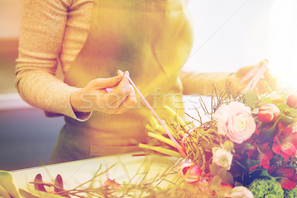 close up of woman making bunch at flower shop Stock photo © dolgachov