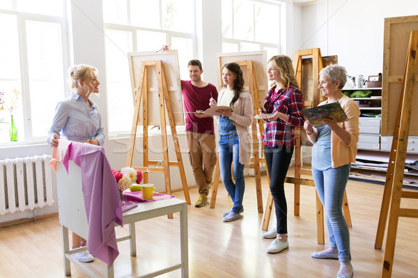 students and teacher with still life at art school Stock photo © dolgachov