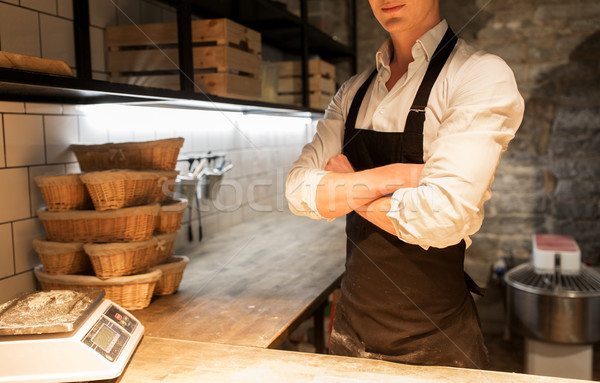 chef or baker in apron at bakery kitchen Stock photo © dolgachov