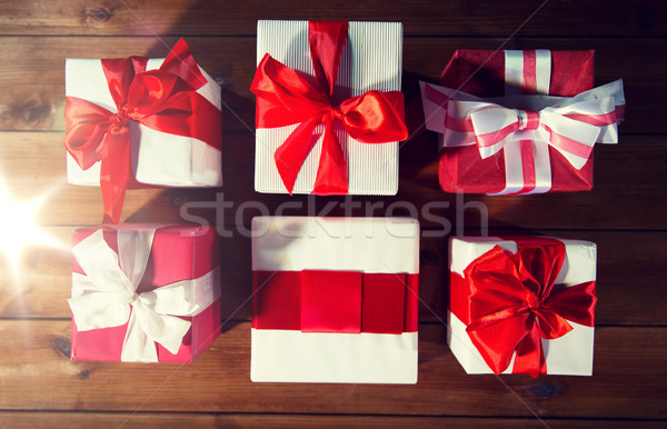 close up of gift boxes on wooden floor from top Stock photo © dolgachov