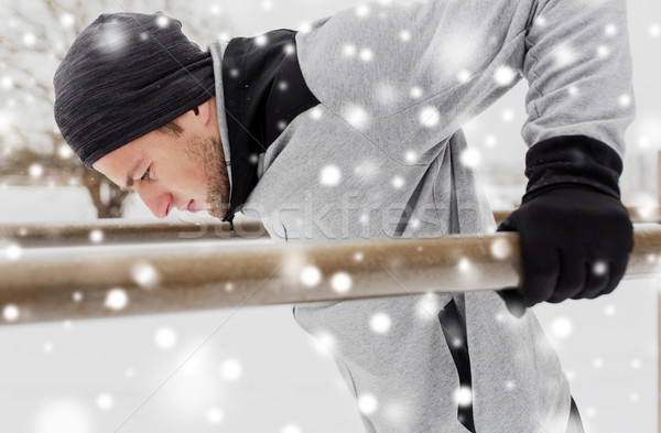 Jeune homme parallèle bars hiver fitness [[stock_photo]] © dolgachov