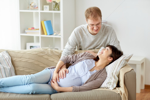 happy pregnant wife with husband at home Stock photo © dolgachov