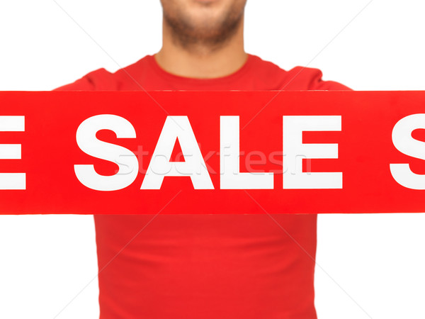 man holding sale sign Stock photo © dolgachov