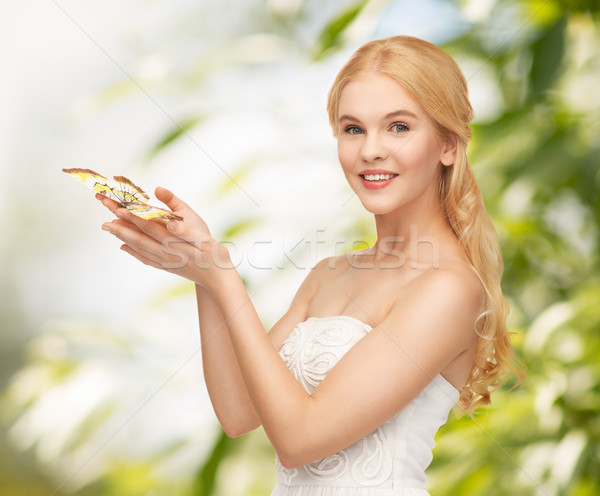 woman with butterfly in hand Stock photo © dolgachov