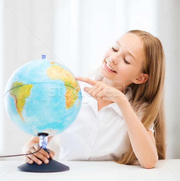 student girl with globe at school Stock photo © dolgachov