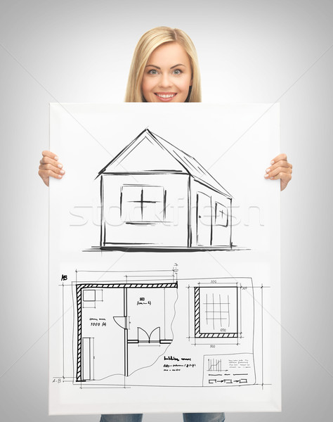 woman holding picture with house Stock photo © dolgachov