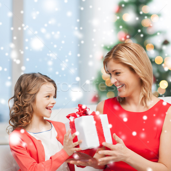 happy mother and child girl with gift box Stock photo © dolgachov