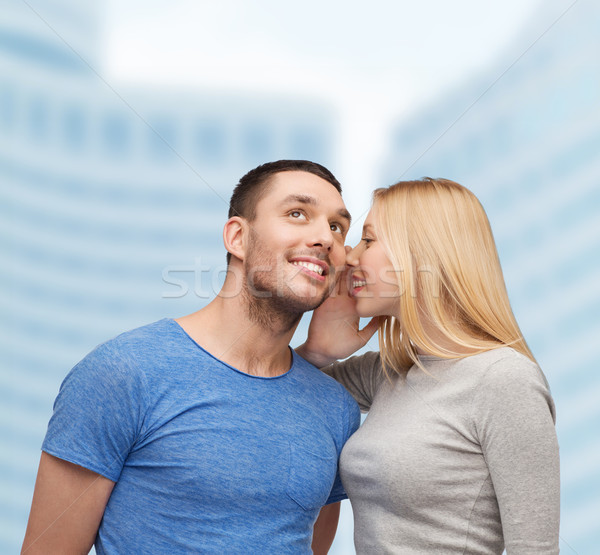 smiling girlfriend telling boyfriend secret Stock photo © dolgachov