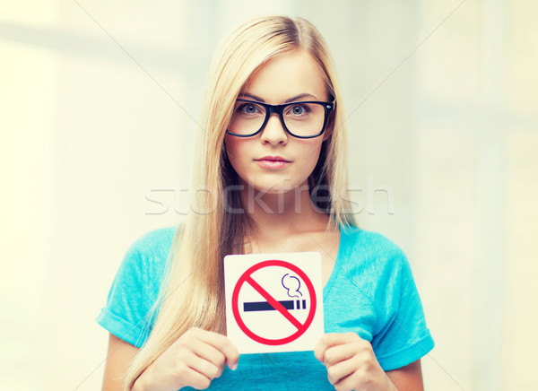 woman with smoking restriction sign Stock photo © dolgachov